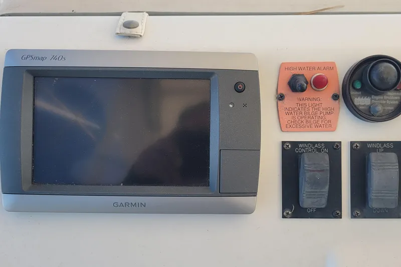 Slide: The Image of Control panel of a 2001 Luhrs 34 Convertible boat with GPS and high water alarm. - 22