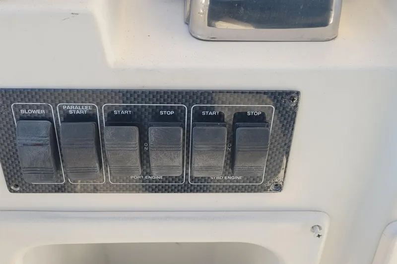 Slide: The Image of Control panel of a 2001 Luhrs 34 Convertible boat with engine switches. - 23