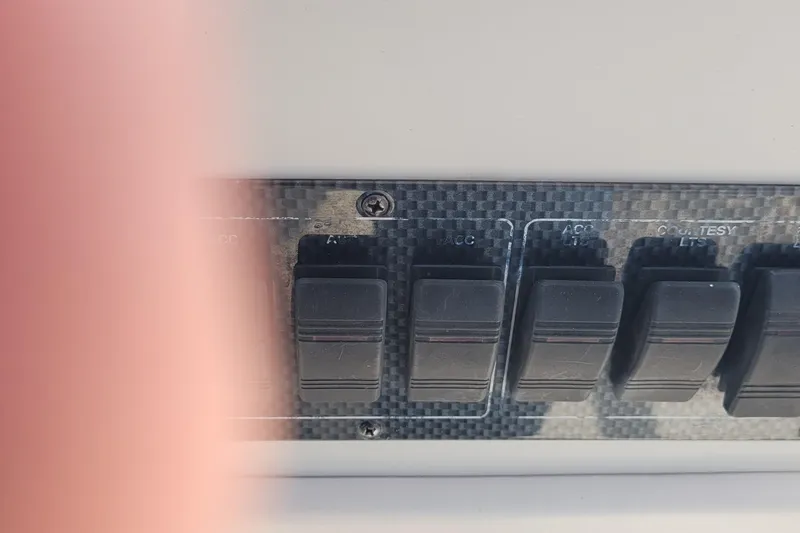 Slide: The Image of Control panel switches on a 2001 Luhrs 34 Convertible boat. - 24