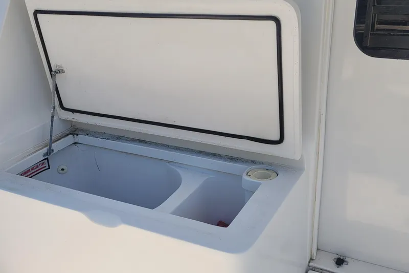 Slide: The Image of Open storage compartment on 2001 Luhrs 34 Convertible boat. - 30