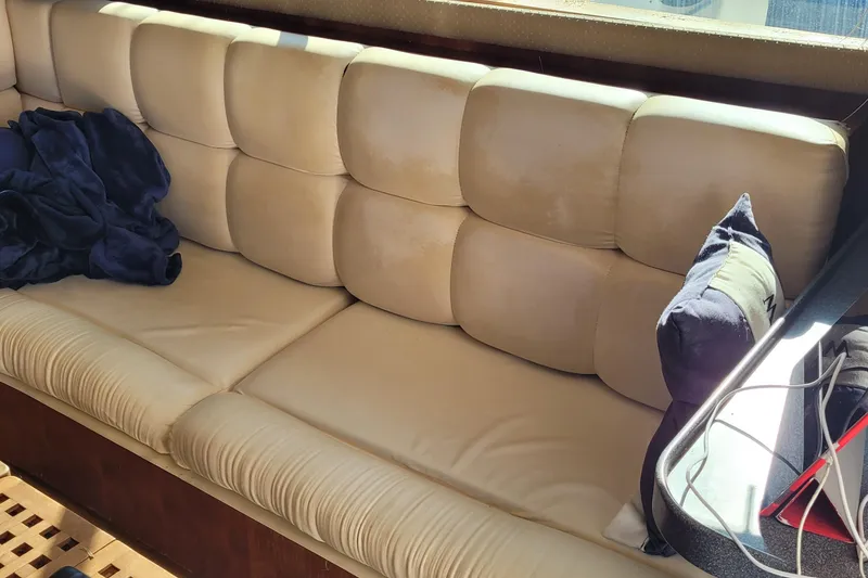 Slide: The Image of Cream leather seating in 2001 Luhrs 34 Convertible boat interior. - 31