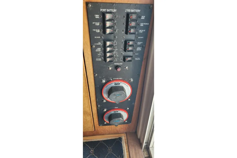 Slide: The Image of Electrical panel of 2001 Luhrs 34 Convertible boat with battery switches and controls. - 36