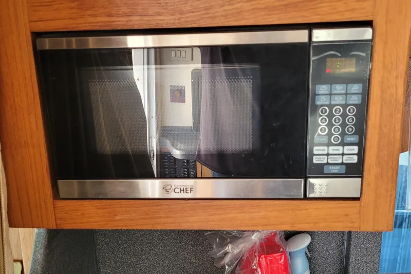 Slide: The Image of Microwave oven in 2001 Luhrs 34 Convertible boat kitchen setup. - 39