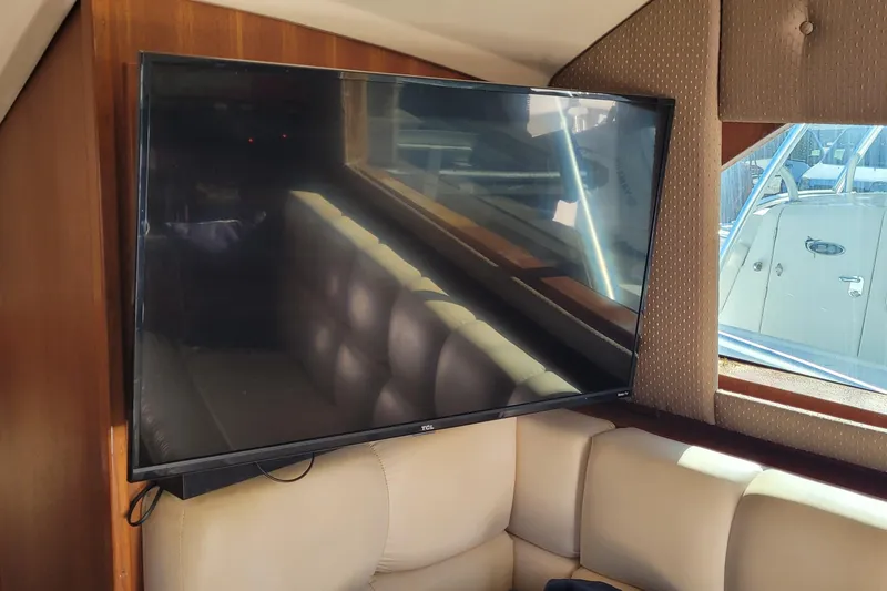 Slide: The Image of Flat-screen TV in the cabin of a 2001 Luhrs 34 Convertible boat. - 42