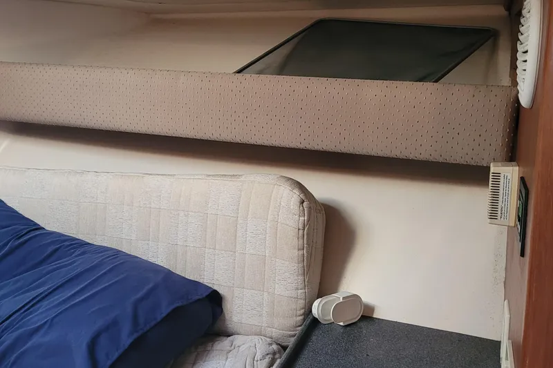 Slide: The Image of Interior cabin of 2001 Luhrs 34 Convertible boat with bed and window. - 44