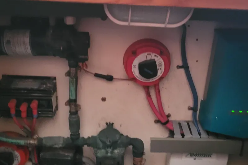 Slide: The Image of Electrical system components inside a 2001 Luhrs 34 Convertible boat. - 47