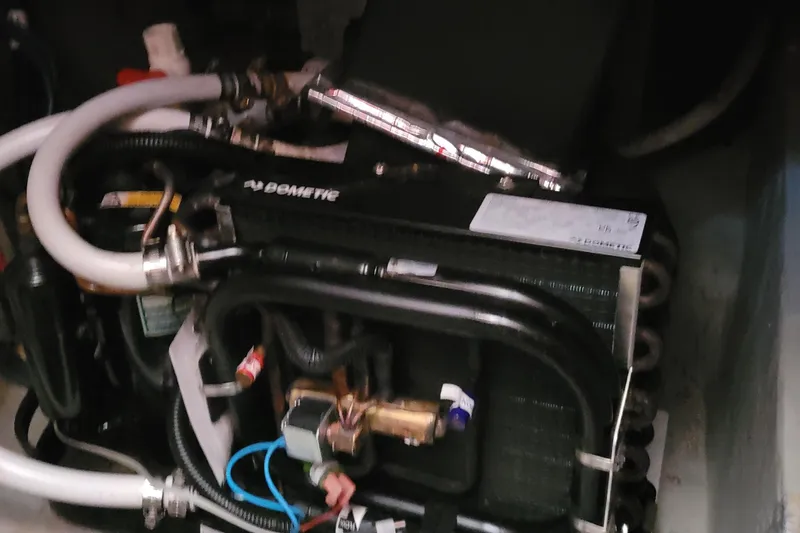 Slide: The Image of Engine compartment of 2001 Luhrs 34 Convertible boat with Dometic equipment. - 48