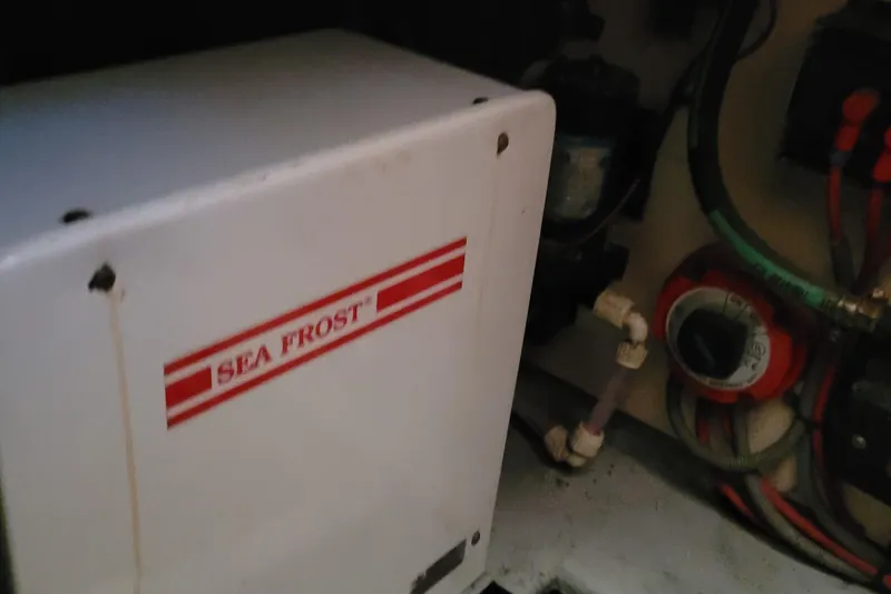 Slide: The Image of Engine room of 2001 Luhrs 34 Convertible with Sea Frost refrigeration unit. - 49