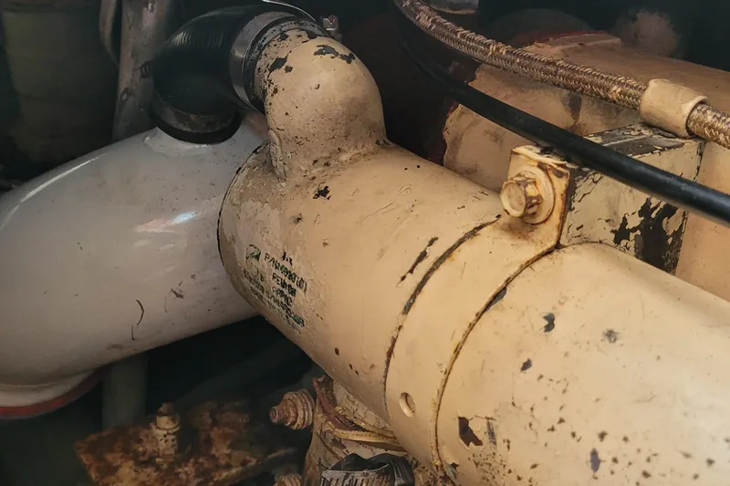 Slide: The Image of Engine component of a 2001 Luhrs 34 Convertible boat, showing wear and rust. - 53