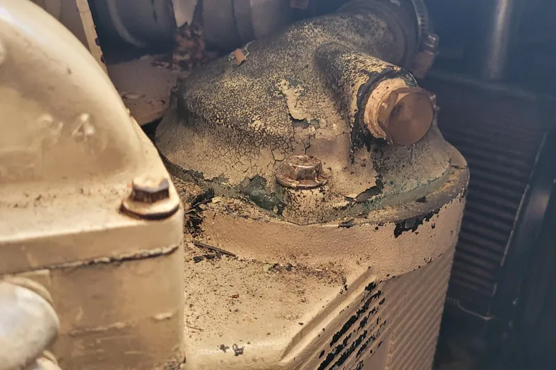 Slide: The Image of Aging engine component of 2001 Luhrs 34 Convertible boat, showing wear and corrosion. - 55