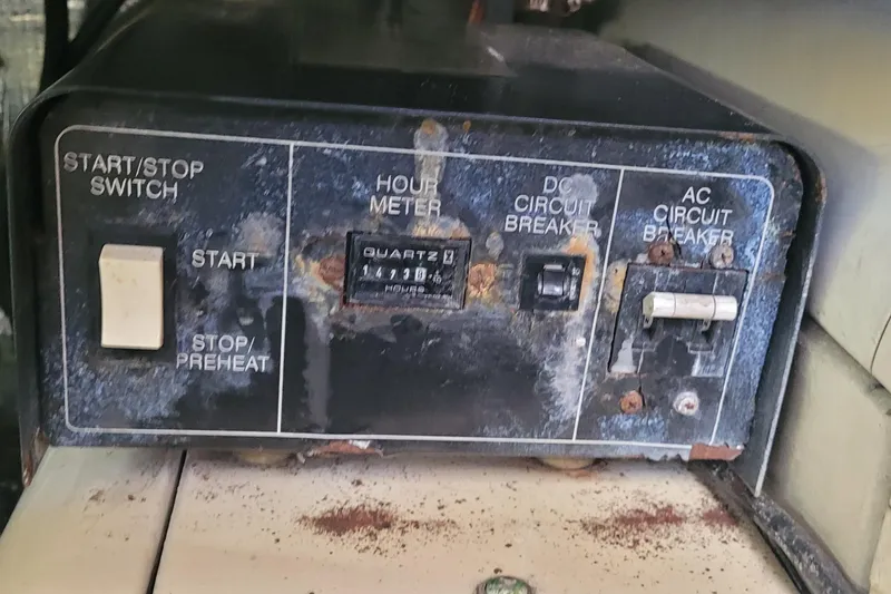 Slide: The Image of Control panel of a 2001 Luhrs 34 Convertible boat with hour meter and circuit breakers. - 57