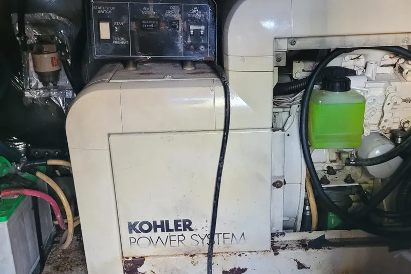 Slide: The Image of Kohler power system in 2001 Luhrs 34 Convertible boat engine room. - 58