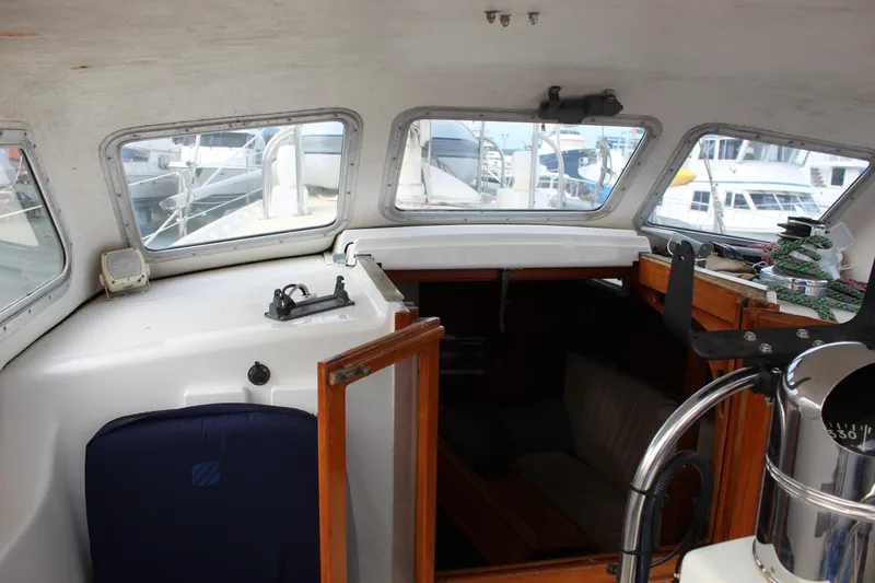 Slide: The Image of Interior view of a 1979 Spencer Yachts 53, showcasing cabin entrance and helm area. - 16