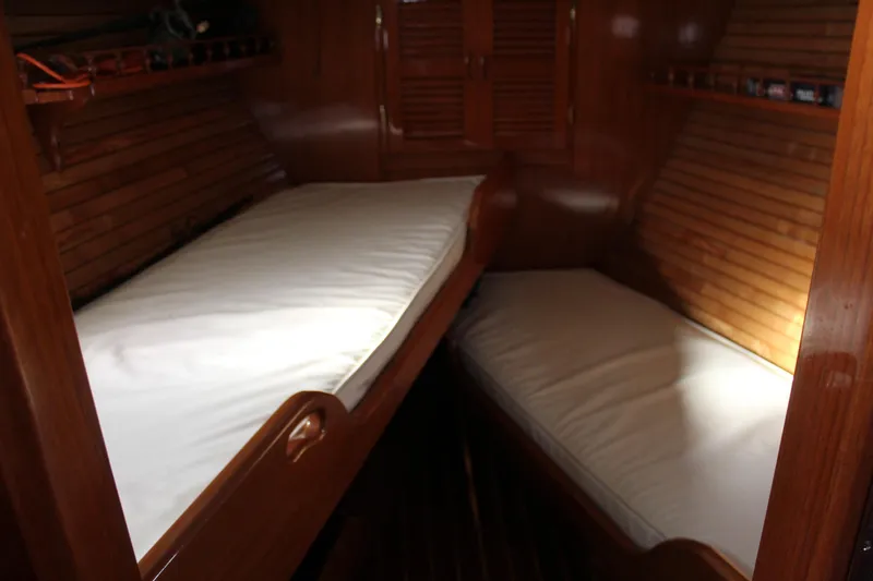 Slide: The Image of Interior cabin of 1979 Spencer Yachts 53 with wooden paneling and twin beds. - 35