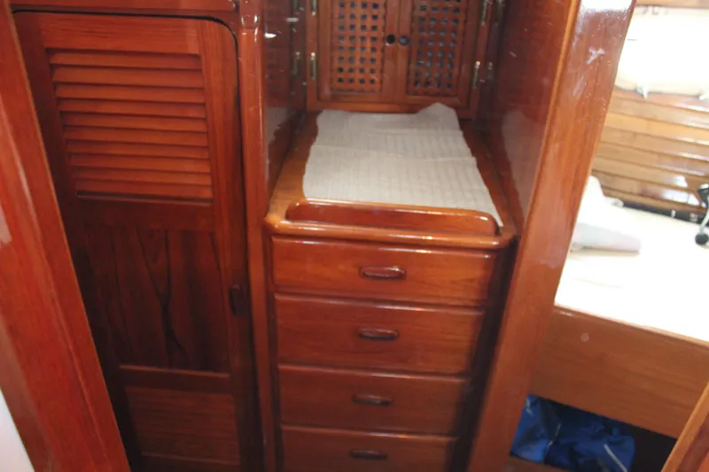 Slide: The Image of Wooden interior of 1979 Spencer Yachts 53, featuring drawers and cabinet. - 38