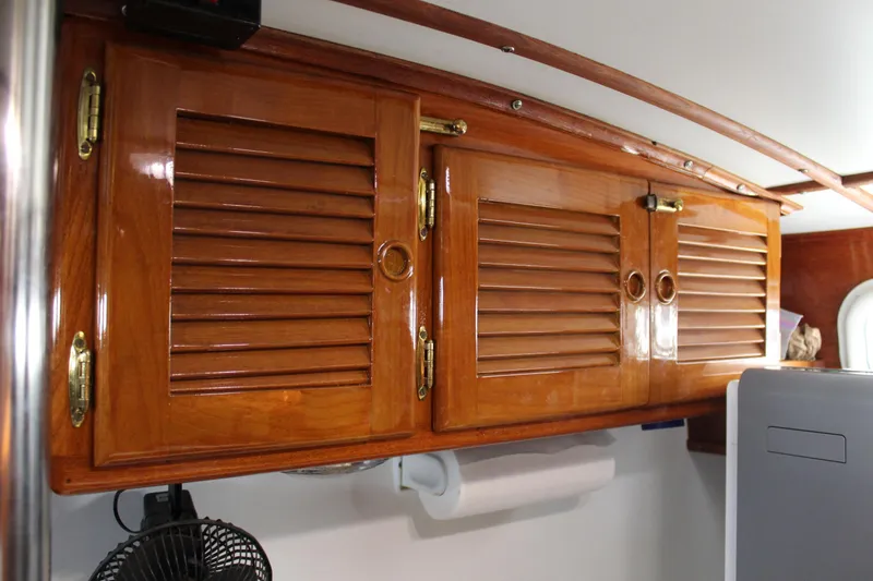 Slide: The Image of Polished wooden cabinets inside a 1979 Spencer Yachts 53, showcasing classic nautical design. - 47