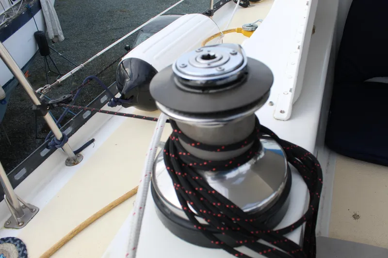 Slide: The Image of Winch on 1979 Spencer Yachts 53 sailboat deck with ropes and railing. - 51