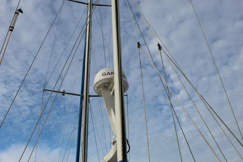 Slide: The Image of Mast and rigging of 1979 Spencer Yachts 53 against a cloudy sky. - 61