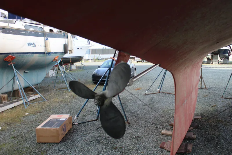 Slide: The Image of 1979 Spencer Yachts 53 propeller and hull in boatyard setting. - 63