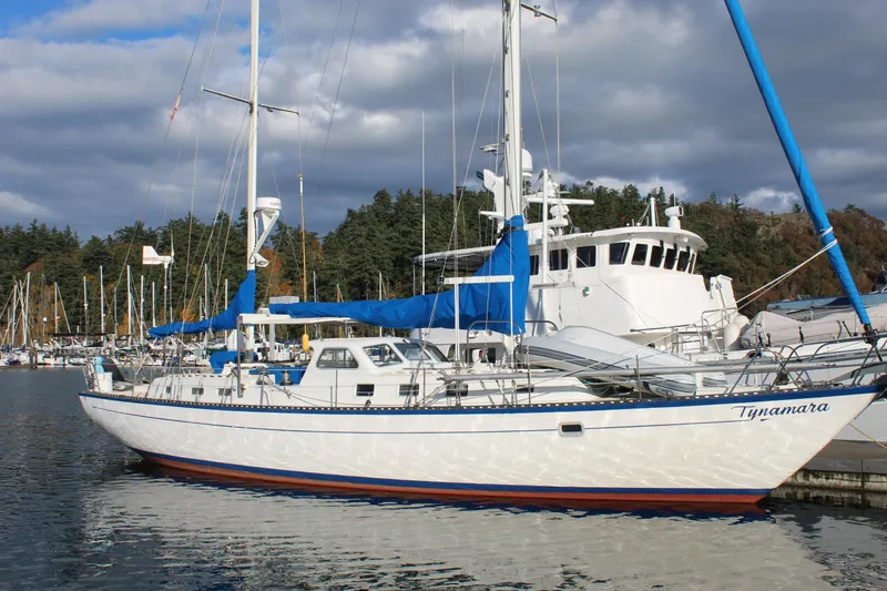 Slide: The Image of 1979 Spencer Yachts 53 sailboat docked in a marina under cloudy skies. - 7