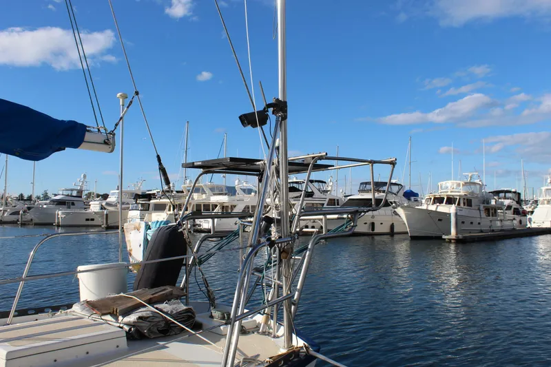 Slide: The Image of Marina view with Spencer Yachts 53, 1979 model, under clear blue sky. - 10