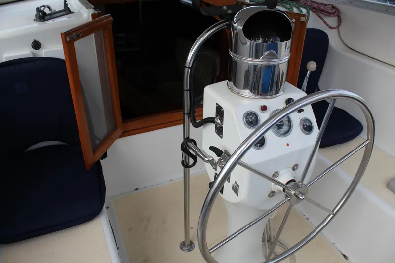 Slide: The Image of Helm of 1979 Spencer Yachts 53 with steering wheel and navigation instruments. - 15