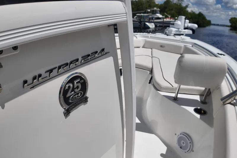 Slide: The Image of 2021 Sea Hunt Ultra 234 boat interior with 25th anniversary emblem. - 16