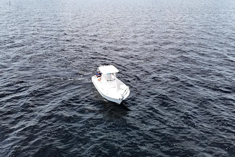 Slide: The Image of Aerial view of 2021 Sea Hunt Ultra 234 boat on open water. - 37