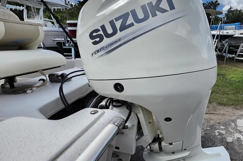 Slide: The Image of 2017 Carolina Skiff 1765 DLX with Suzuki four-stroke outboard motor. - 27