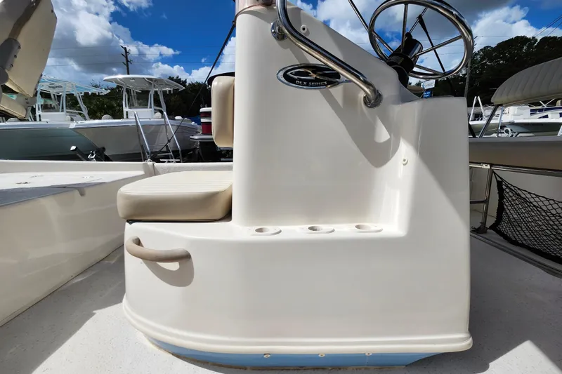 Slide: The Image of 2017 Carolina Skiff 1765 DLX boat console with steering wheel and seating. - 30