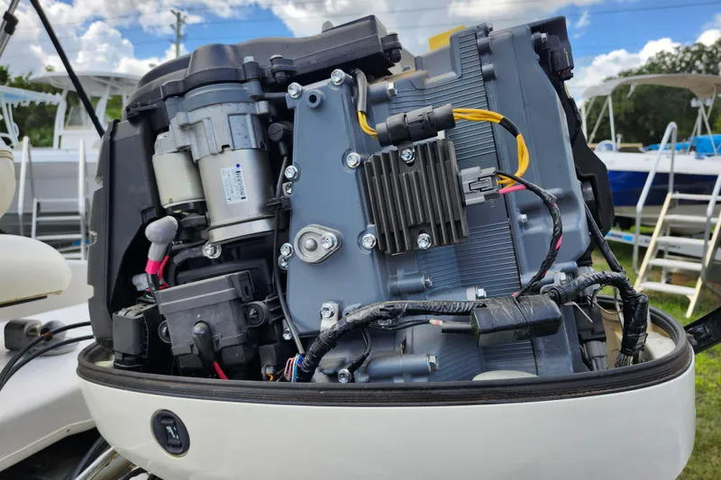 Slide: The Image of Close-up of a 2017 Carolina Skiff 1765 DLX boat engine components. - 35