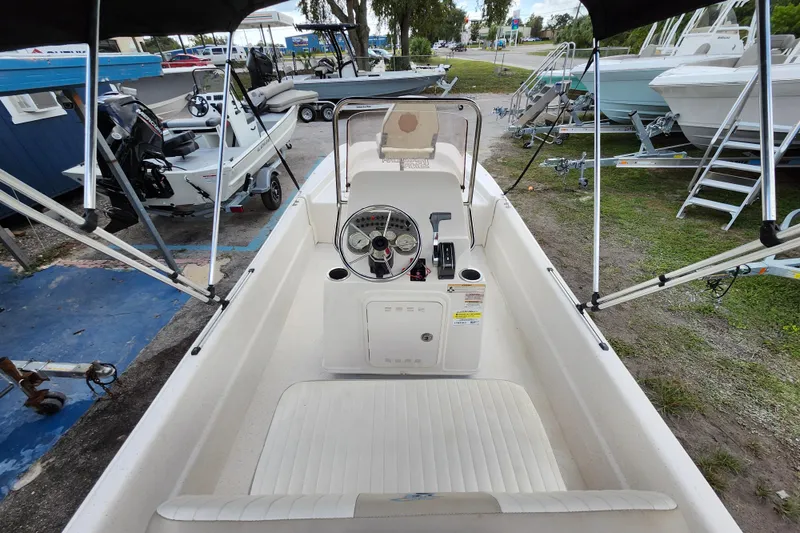 Slide: The Image of 2017 Carolina Skiff 1765 DLX boat interior with steering console and seating. - 7