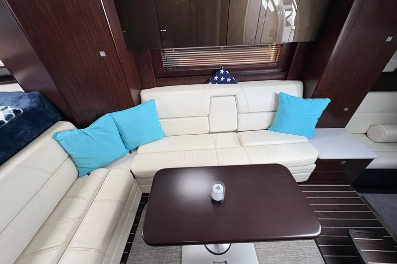 Slide: The Image of Luxurious interior of 2018 Monterey 335 Sport Yacht with white seating and blue cushions. - 18
