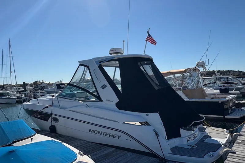 Slide: The Image of 2018 Monterey 335 Sport Yacht docked at marina under clear blue sky. - 3