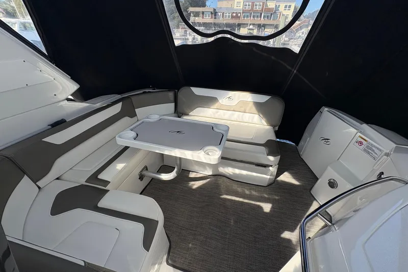 Slide: The Image of Interior of 2018 Monterey 335 Sport Yacht with seating and table setup. - 5