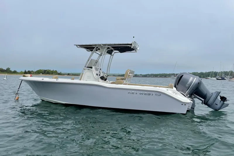 The Image of 2020 Key West 239 FS boat on calm water with Yamaha outboard motor. - 0
