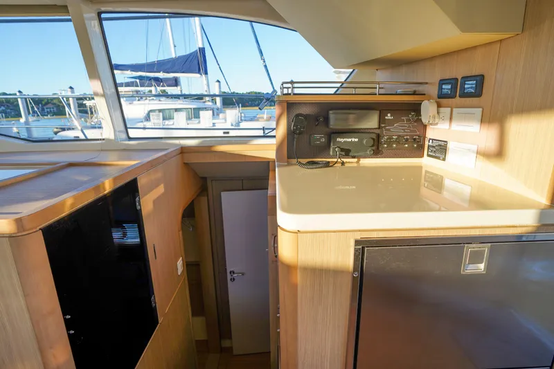 Slide: The Image of Interior of 2021 Aquila 44 Yacht featuring navigation equipment and modern design. - 10