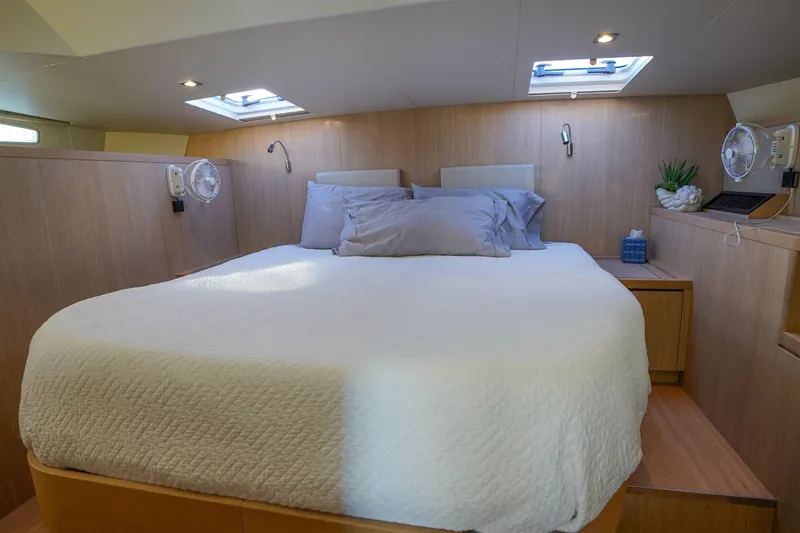 Slide: The Image of Luxurious bedroom interior of 2021 Aquila 44 Yacht with skylights and modern decor. - 12