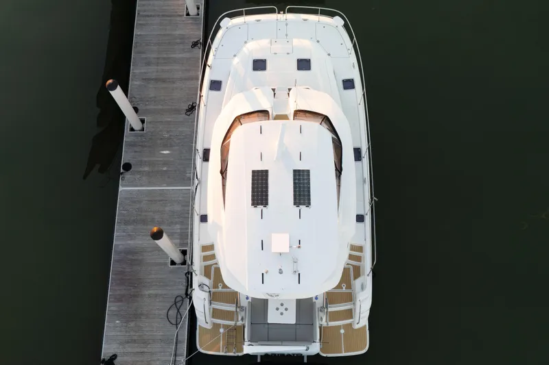 Slide: The Image of Aerial view of 2021 Aquila 44 Yacht docked at a marina. - 3