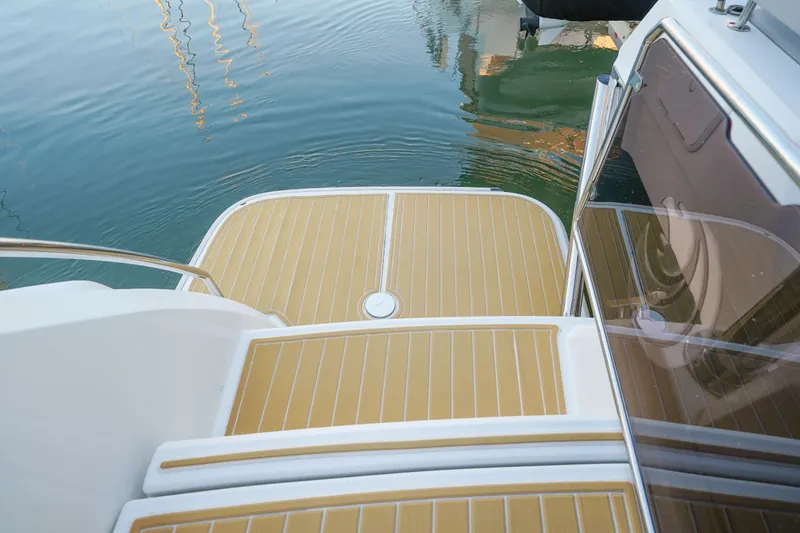 Slide: The Image of Aquila 44 Yacht 2021, rear deck view with water reflection. - 33