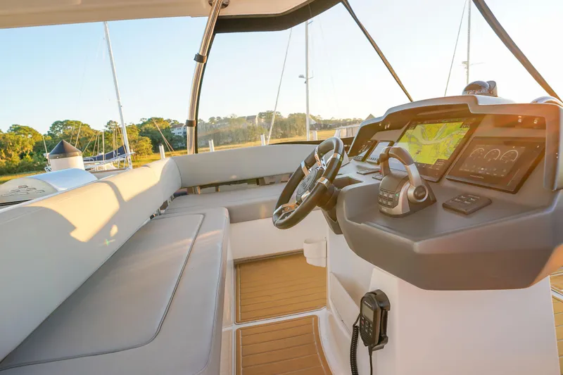 Slide: The Image of Cockpit of 2021 Aquila 44 Yacht with modern navigation equipment and comfortable seating. - 41