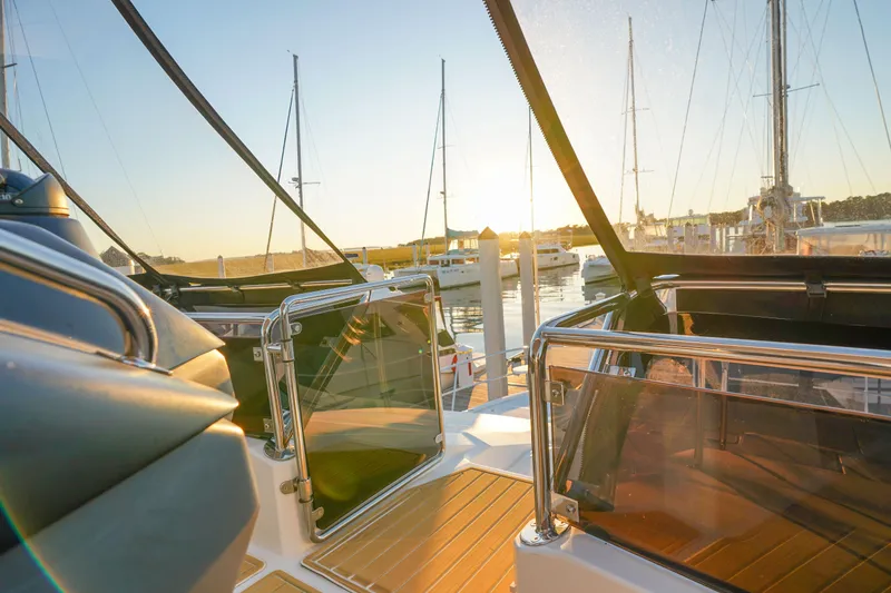 Slide: The Image of Aquila 44 Yacht 2021 at sunset in marina, showcasing sleek design and luxury features. - 42