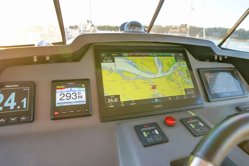 Slide: The Image of Aquila 44 Yacht 2021 dashboard with navigation and control displays. - 44