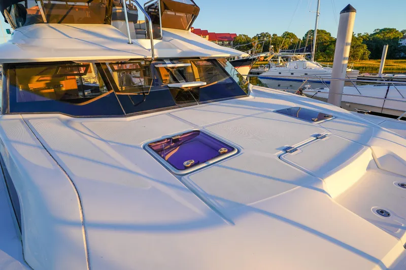 Slide: The Image of 2021 Aquila 44 Yacht docked, showcasing sleek design and modern features. - 49