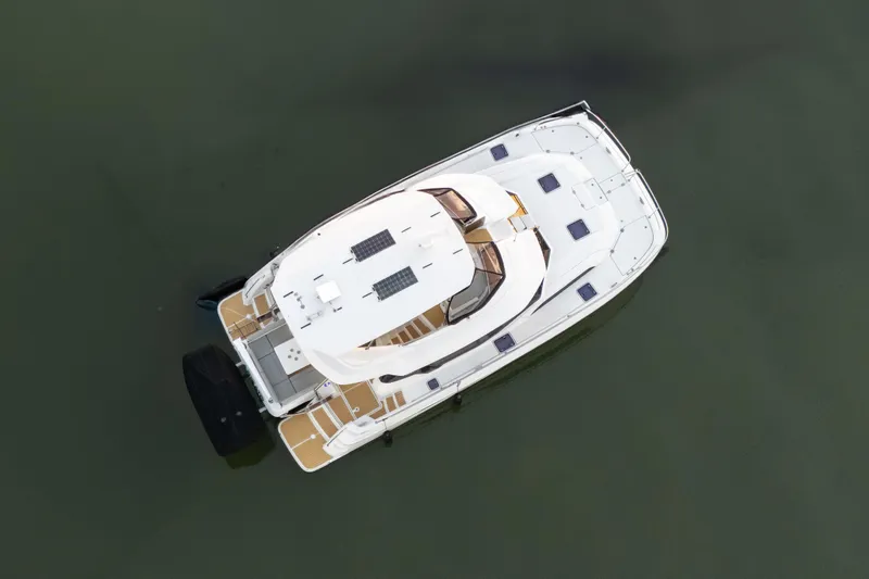 Slide: The Image of Aerial view of 2021 Aquila 44 Yacht on calm water. - 52