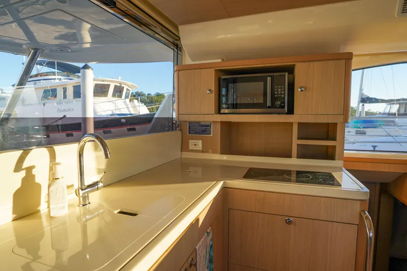 Slide: The Image of Modern kitchen interior of 2021 Aquila 44 Yacht with sink and microwave. - 7