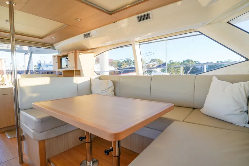 Slide: The Image of Luxurious interior of 2021 Aquila 44 Yacht with elegant seating and dining area. - 9