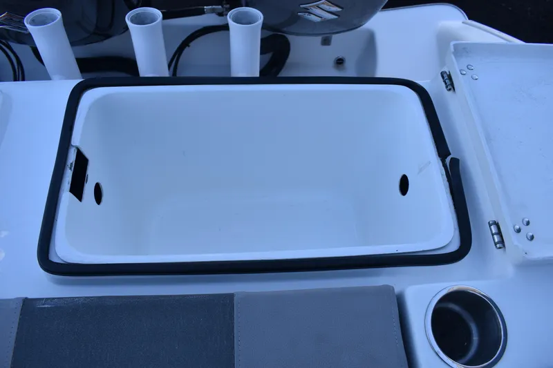 Slide: The Image of 2021 Cape Horn 36 XS boat interior with storage compartment and cup holder. - 29