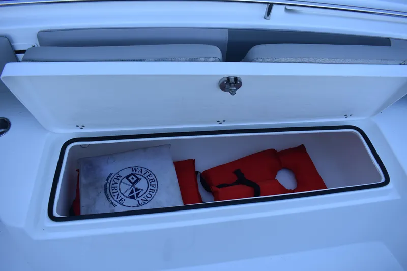 Slide: The Image of 2021 Cape Horn 36 XS boat storage compartment with life jacket and marine bag. - 38
