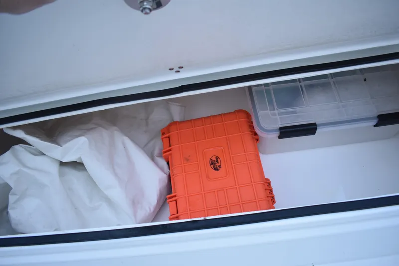 Slide: The Image of Storage compartment in 2021 Cape Horn 36 XS boat with orange and clear cases. - 40